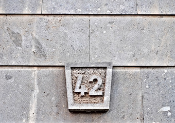 Number 42, forty-two, an ornamental sandstone plate.