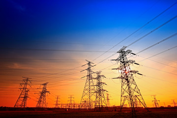 Fototapeta premium Electric tower, silhouette at sunset