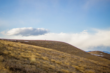 People in the Distance on a Hill
