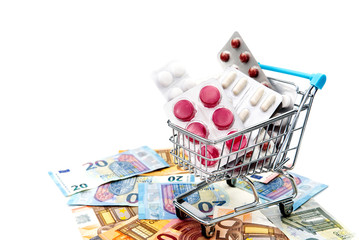 Fototapeta na wymiar Isolated shopping cart full of medicine with pills and capsules and euro banknotes. money . drug cost concept