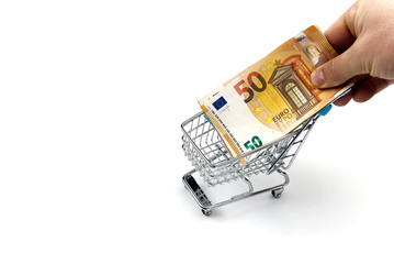 Closeup of a shopping cart full of euro banknotes isolated on white. concept: loan, investment,...