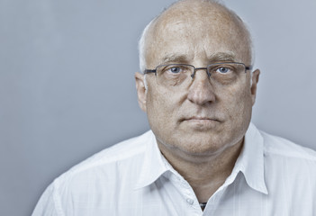 Man with glasses and white collar