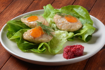 Traditional Jewish Passover food- gefilte fish with carrots, lettuce and horseradish. Rosh Hashana table setting