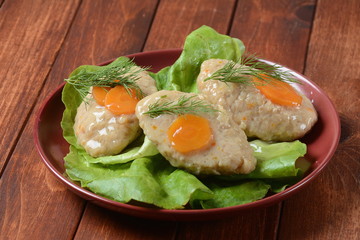 Poached egg with green cucumber, arugula beet leaves , smoked salmon and spices on a toast, wooden background. Healthy French breakfast concept 