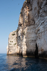 blue water with cliffs