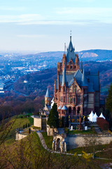 Fototapeta premium Medieval castle - Schloss Drachenburg, big pink palace in Konigswinter. Cloister of knights located on Rhine river near the city of Bonn in Germany