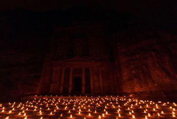 Candles in front of the Al Khazneh temple (The Treasury) in the ancient city Petra, Jordan
