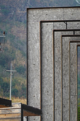 Parts of a modern steel and wooden building. mountain background.      