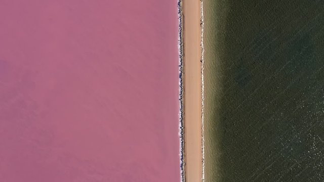 Smooth 4K drone footage over Lake MacDonnell, a naturally occuring pink salt lake located near Penong in South Australia
