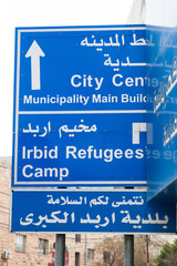 Direction signs in Irbid, Jordan. City centre, Municipality, Refugees Camp.