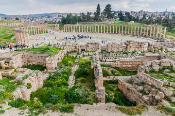 JERASH, JORDAN - APRIL 1, 2017: Tourists at the Forum of the ancient city Jerash, Jordan