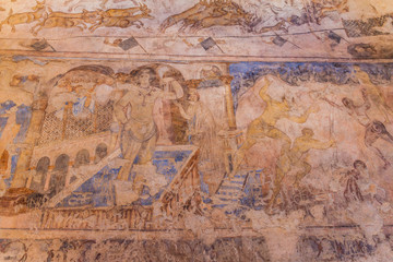 QUSAYR AMRA, JORDAN - APRIL 3, 2017: Frescoes of bathing women in Qusayr Amra (sometimes Quseir Amra or Qasr Amra), one of the desert castles located in eastern Jordan