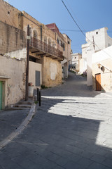 Fototapeta na wymiar Narrow steep street in Salt town, Jordan