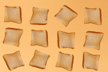 Toast suspended in front of a yellow background