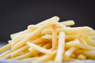French fries on black background - Tasty potato fries for food or snack delicious Italian menu homemade