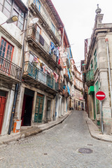 Fototapeta na wymiar PORTO, PORTUGAL - OCTOBER 17, 2017: Narrow steep street in Porto, Portugal