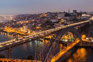 Evening view of Dom Luis bridge over river Douro in Porto, Portugal