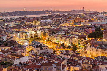 Fototapeta na wymiar Skyline of evening Lisbon from Miradouro da Graca viewpoint, Portugal