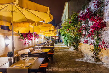Fototapeta premium Night view of an open air restaurant in Obidos village, Portugal