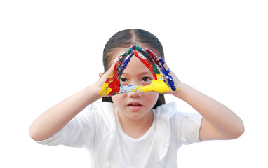 Portrait of Asian little girl looking through her colorful hands painted isolated on white background. Focus at child hands. Kid pose hands triangle in front of her eyes.