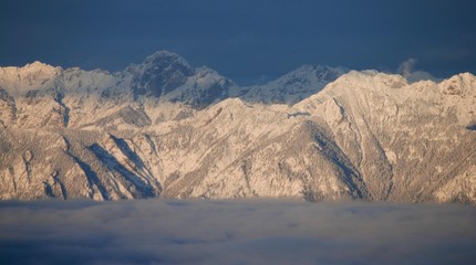 View towards Canadian Rockies in a setting sun at Purcell Mountain Range