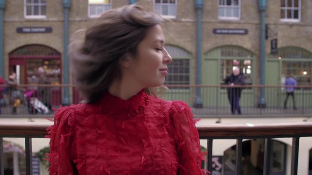 Beautiful eurasian model seductively flick hair and bite lip, slow motion