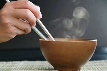 Decorate food, Japanese Food , Breakfast , Lunch and dining by hot soup in wood bowl on mat which...