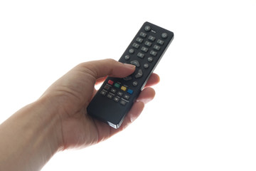His hand is holding the remote control and operate the remote control. on the White Background . Concept of Technology
