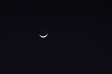 Crescent moon in the night sky background