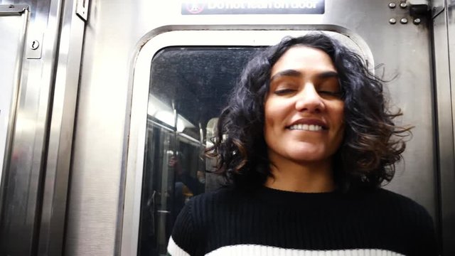 Portrait of young happy multi-ethnic hispanic girl. hipster millennial girl in New York City. Concept of urban modern student lifestyle, fashion in NYC, skater model, multi-ethnic hispanic American.