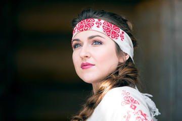 Russian style. Russian woman in national dress. Beautiful Slav with braids. Ethnic model.