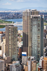 Bird eye view of skyscrapers in the Kita downtown with Yodo River on the background. Osaka. Japan