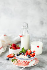 Cottage cheese with fresh strawberries and milk for breakfast. The recipe for the holiday Valentine's Day. Copy space