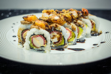 Delicious japanese traditional sushi roll, made with rice, eel sauce, crab, shrimp