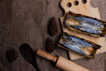 Pindang fish (brine fish) on cutting board. Pindang is a boiling method of fish in salt and certain spices.copy space