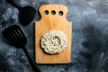 kerupuk is traditional crackers from Java Indonesia. kerupuk or crackers with celery leaf on board , copy space