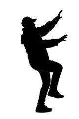 Silhouette of a male hiker or explorer isolated on a white background wearing a hat and clothes for trekking. He is falling or off balance