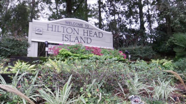 Hilton Head island welcome sign with flowers RED 4k panning slowmo 96 FPS