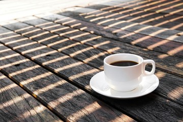 cup of coffee on wooden table
