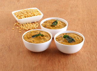 Toor dal chutney, an Indian, delicious, healthy, and vegetarian side dish for items like idli, dosa, chapati, and roti, in three bowls.