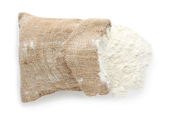 Bag with flour on white background