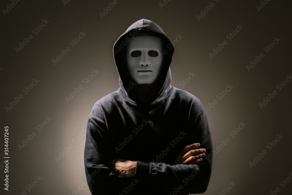 Poster professional hacker in mask on dark background