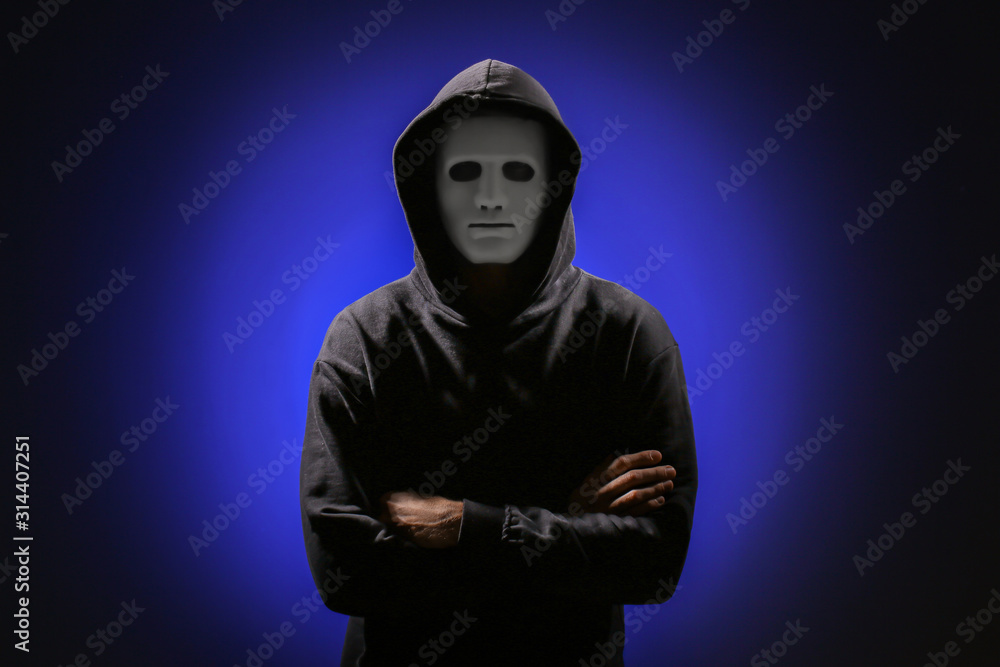 Poster professional hacker in mask on dark background