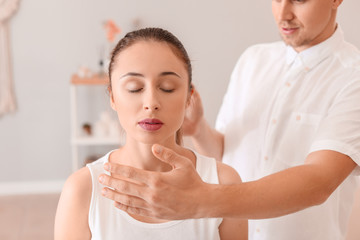 Reiki master working with patient