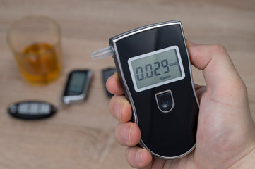 breathalyzer, alcohol and car keys, the concept of driving a car under the influence of alcohol