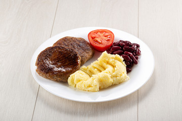 Homemade pork chops cutlets with potato and vegetable