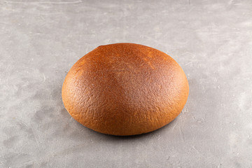 Freshly Baked Homemade Bread, close-up on a stone table