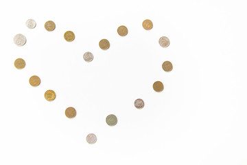 Russian rubles coins in the form of a heart on an isolated white background, money theme