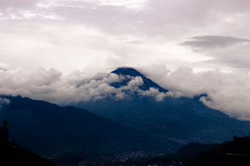 Beauty Silhouette of Sindoro mountain with clouds surround it.view from Dieng Wonosobo ,selective focus
