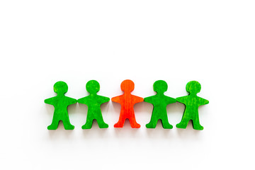 Leader concept. People cutuots - red figure against others on white background top-down copy space